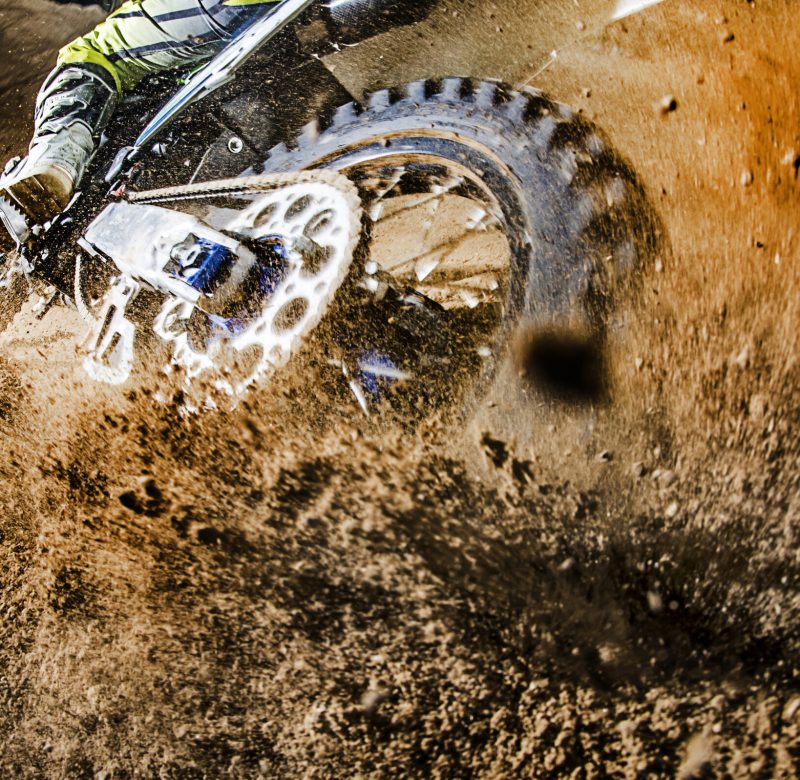 Motorcycle wheel skids very close to the photographer